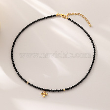 Minimalist black beaded cross necklace for women, chic and elegant choker.